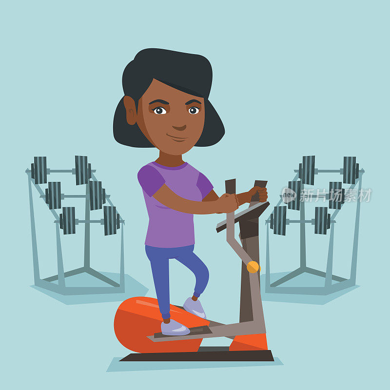 African woman exercising on elliptical trainer